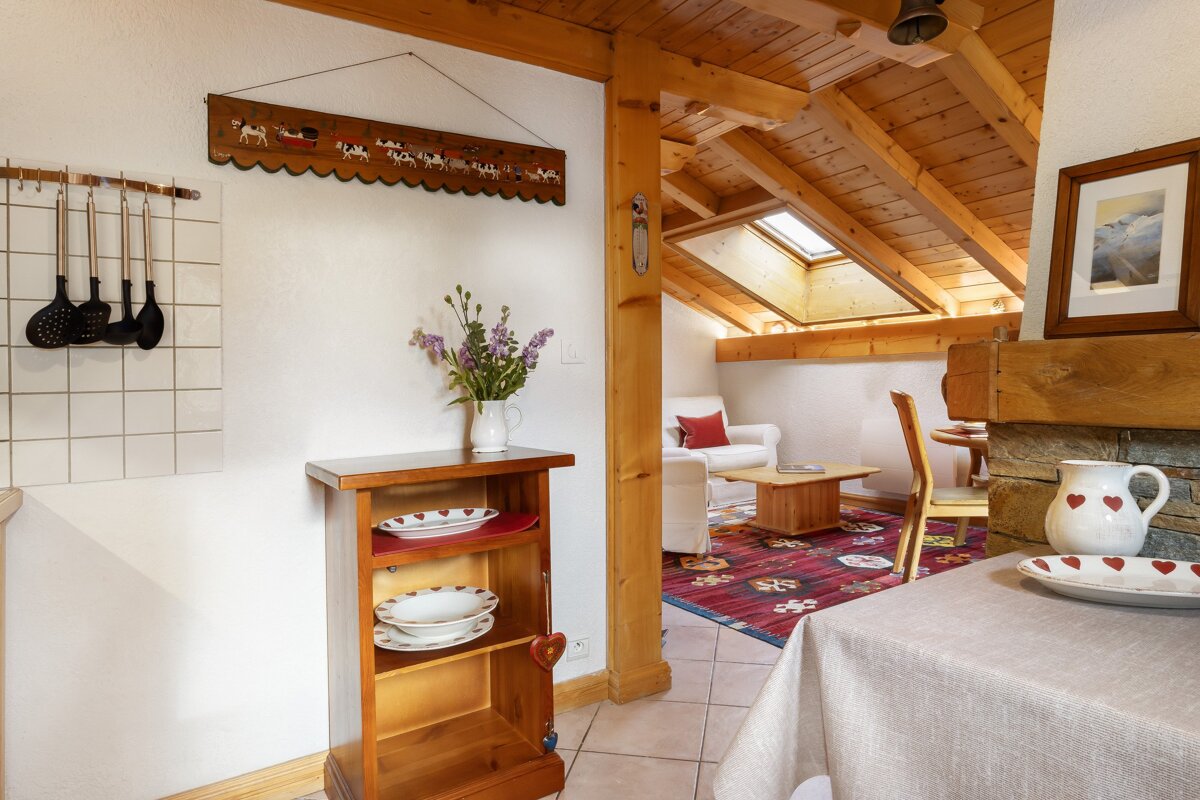 A wooden shelf with plates and bowls on it