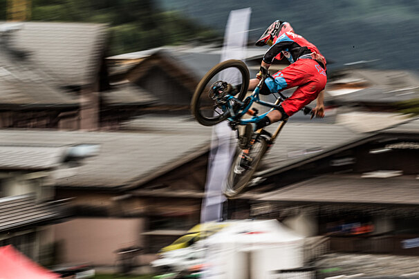 a biker flipping their bike sideways