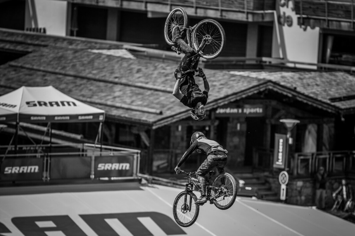 two bikers jumping each other