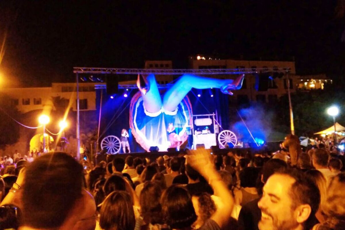 a pair of fake legs poking out from a stage