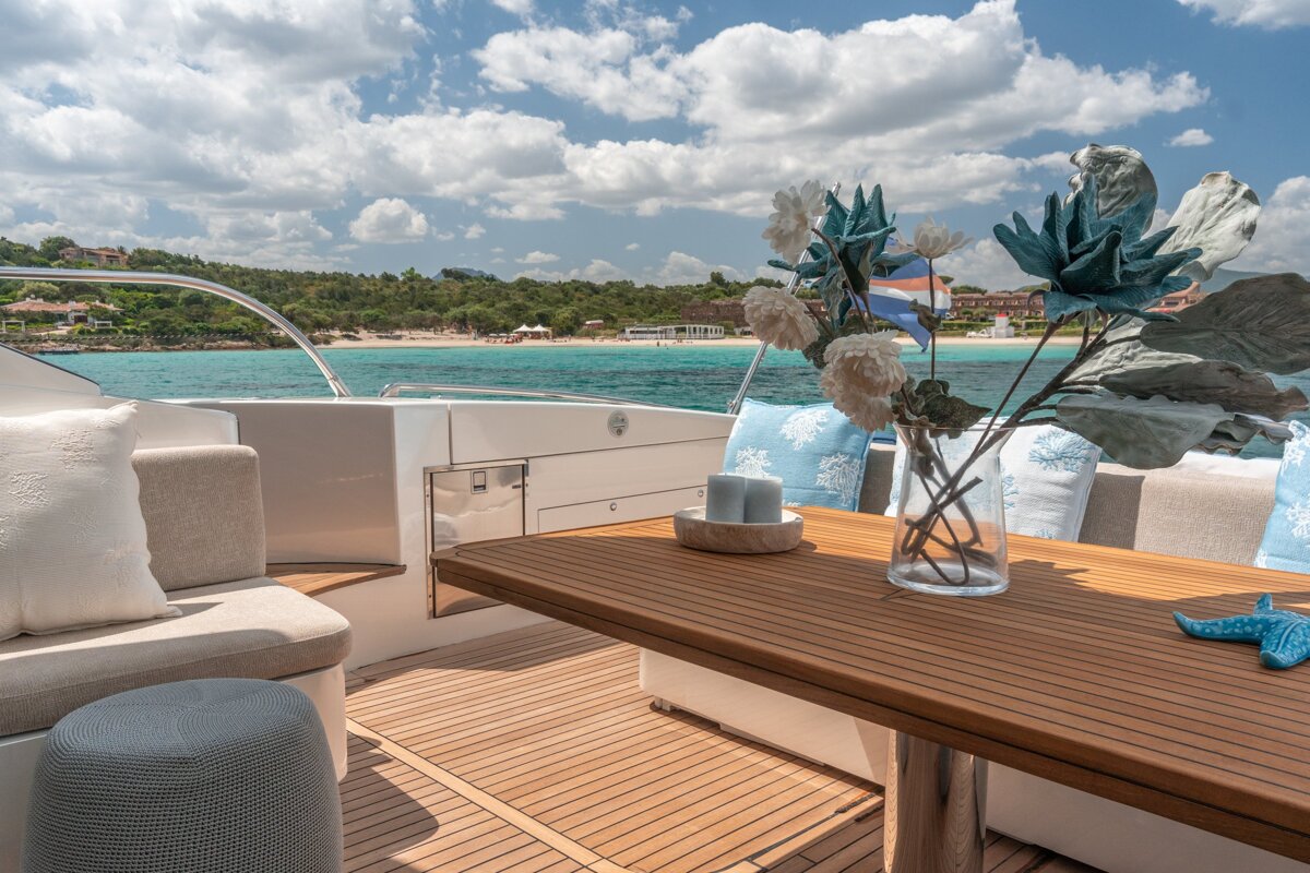 A wooden table with a vase of flowers on it