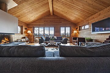 A living room filled with furniture and a fireplace