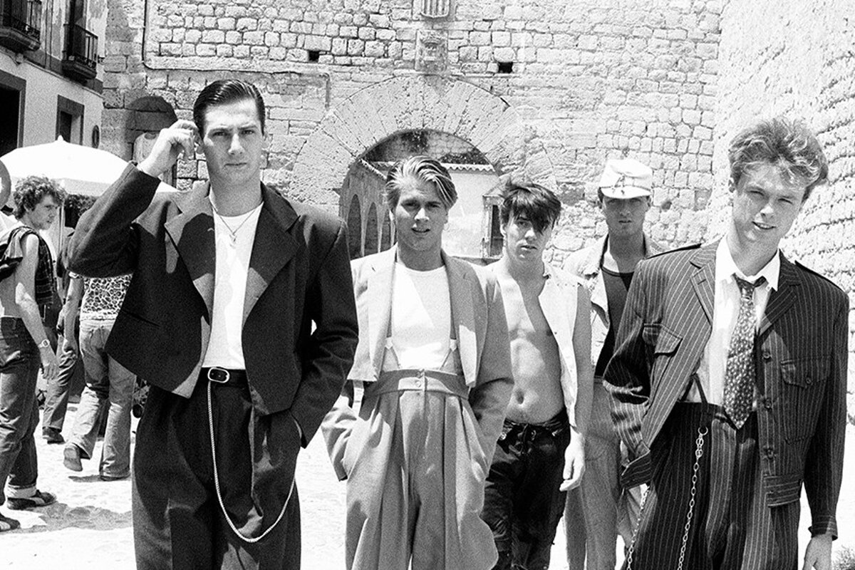 an old black & white photo of a pop band