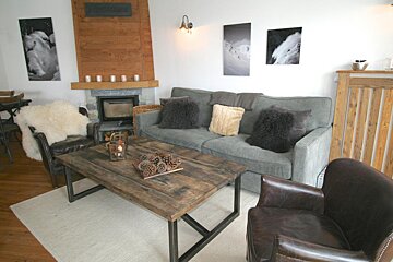 A living room with a couch and a coffee table