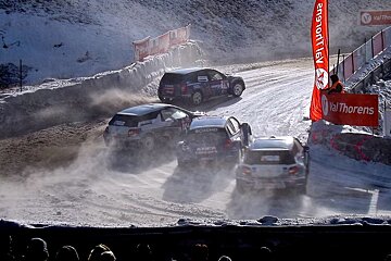 cars racing around an icy track in val thorens