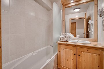 A bathroom with a sink and a bathtub