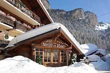 The hotel neige et roc is covered in snow