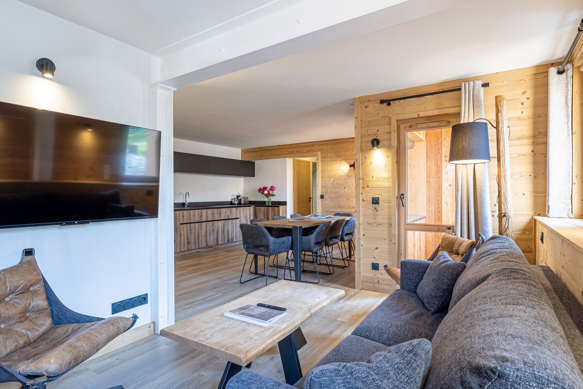 A living room with a couch and a flat screen tv