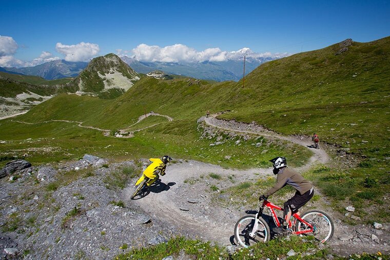 two mountain bikers on berms in La Plagne