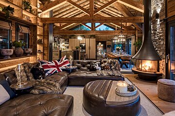 A living room filled with furniture and a fireplace