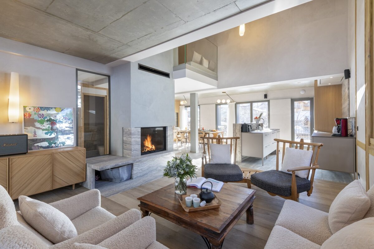 A living room with a fireplace and a marshall speaker