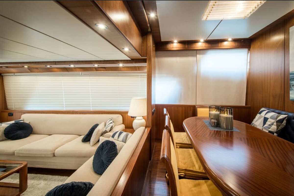 A living room with a couch and a table with candles on it