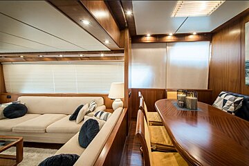 A living room with a couch and a table with candles on it