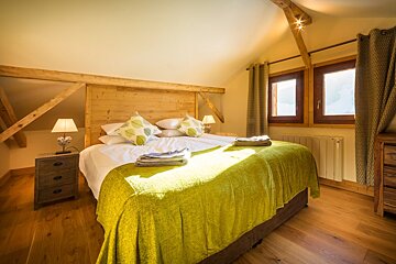 a room with multiple beds for families