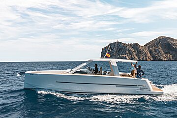 A white boat with the number vnm-153 on the side