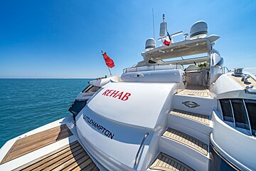 A white yacht with rehab written on the side