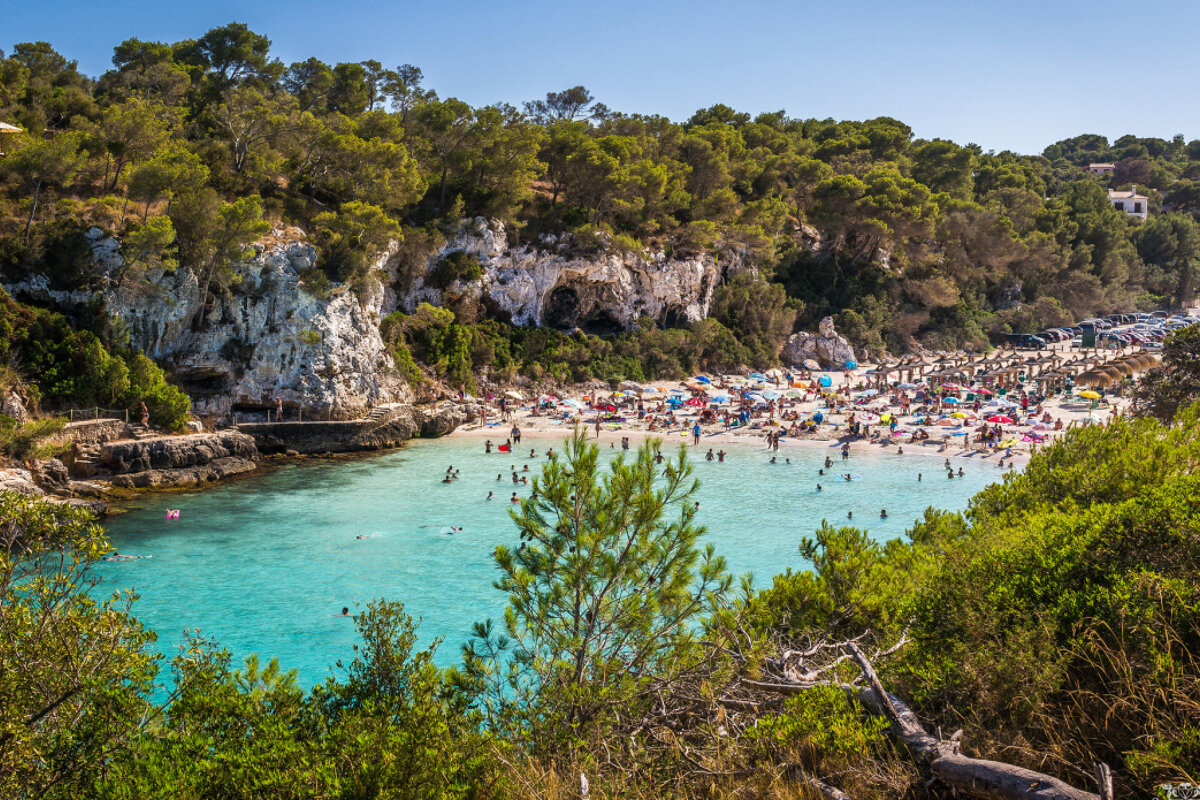 a view looking over the cove of cala llombards
