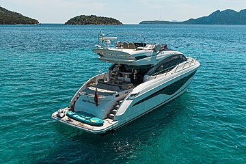 A sleek white yacht,