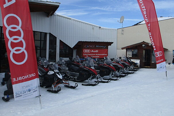 skidoos lined up outside a building