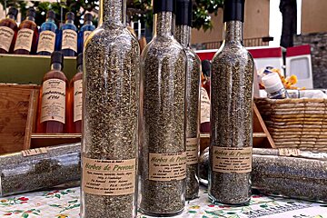 bottles of herbs for sale at the market