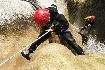 people canyoning on a river
