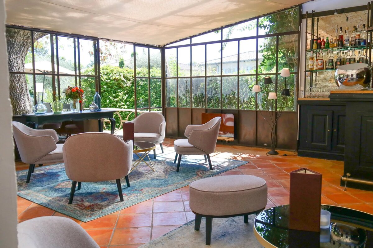 A room with a lot of chairs and a bar