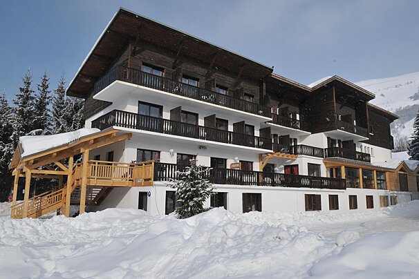 A large building with a sign that says ' hotel ' on it