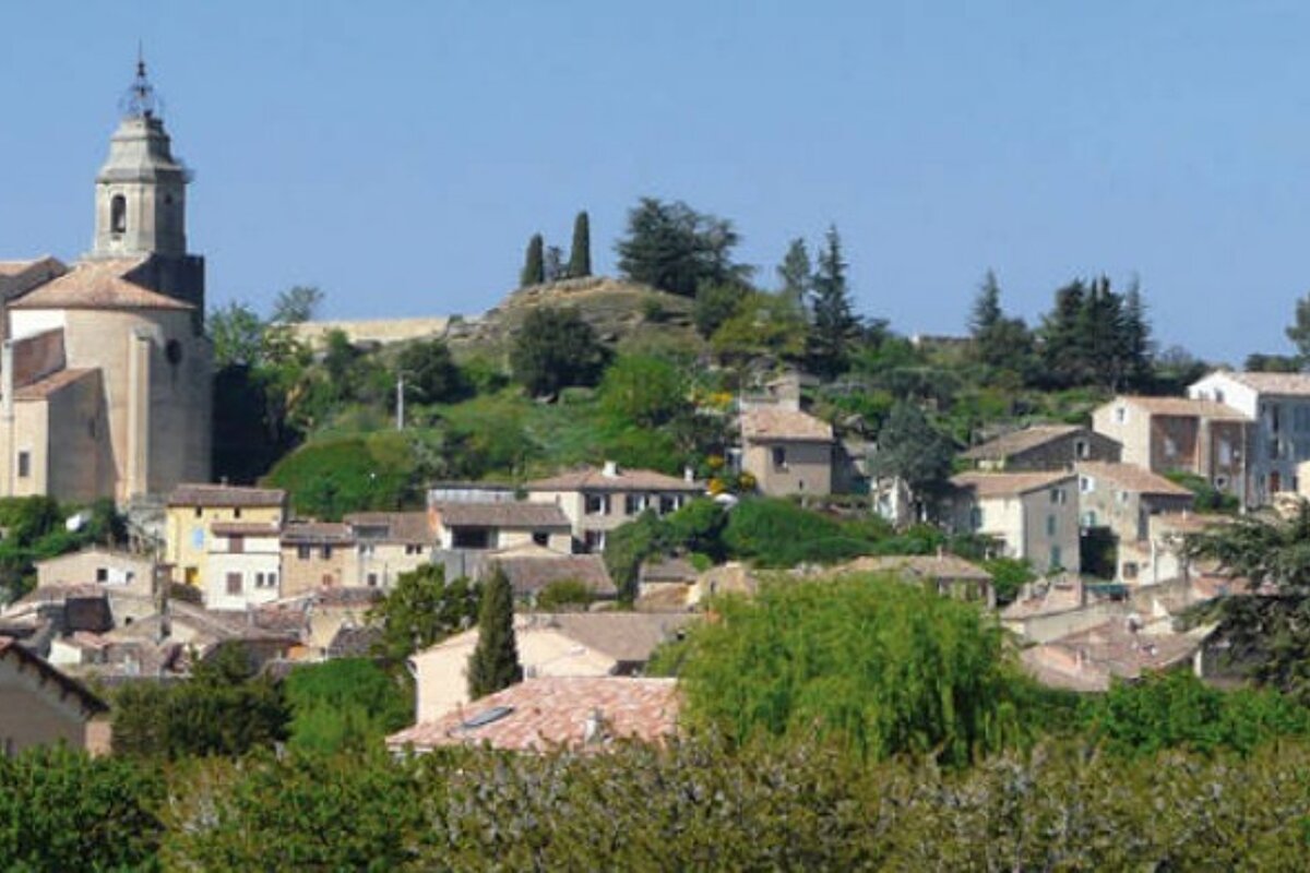 A small town with a church on top of a hill