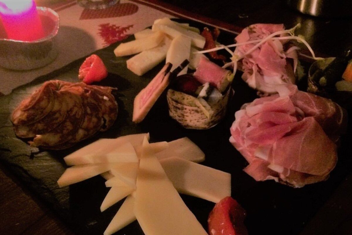 meats and cheese on a platter