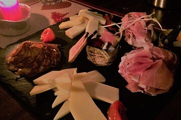 meats and cheese on a platter