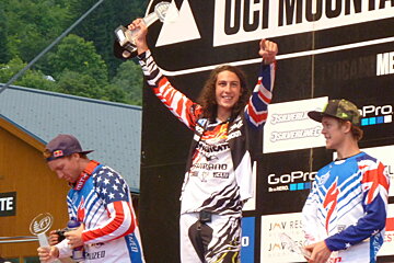 3 men on a winners podium