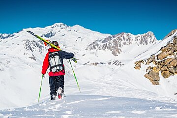 Skier boot packing in Val d'Isere
