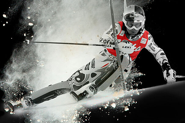 a skier racing round a slalom pole