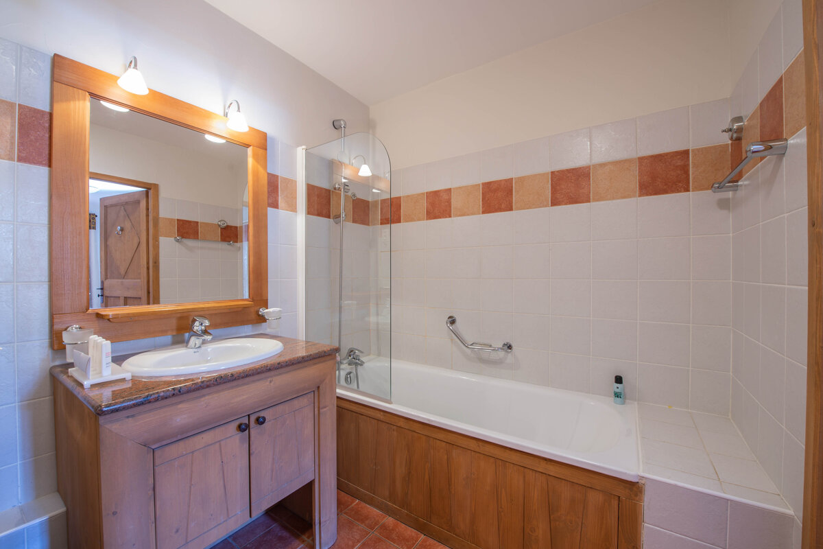 A bathroom with a sink and a bathtub