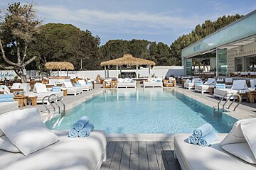 A swimming pool with a sign that says ibiza on it