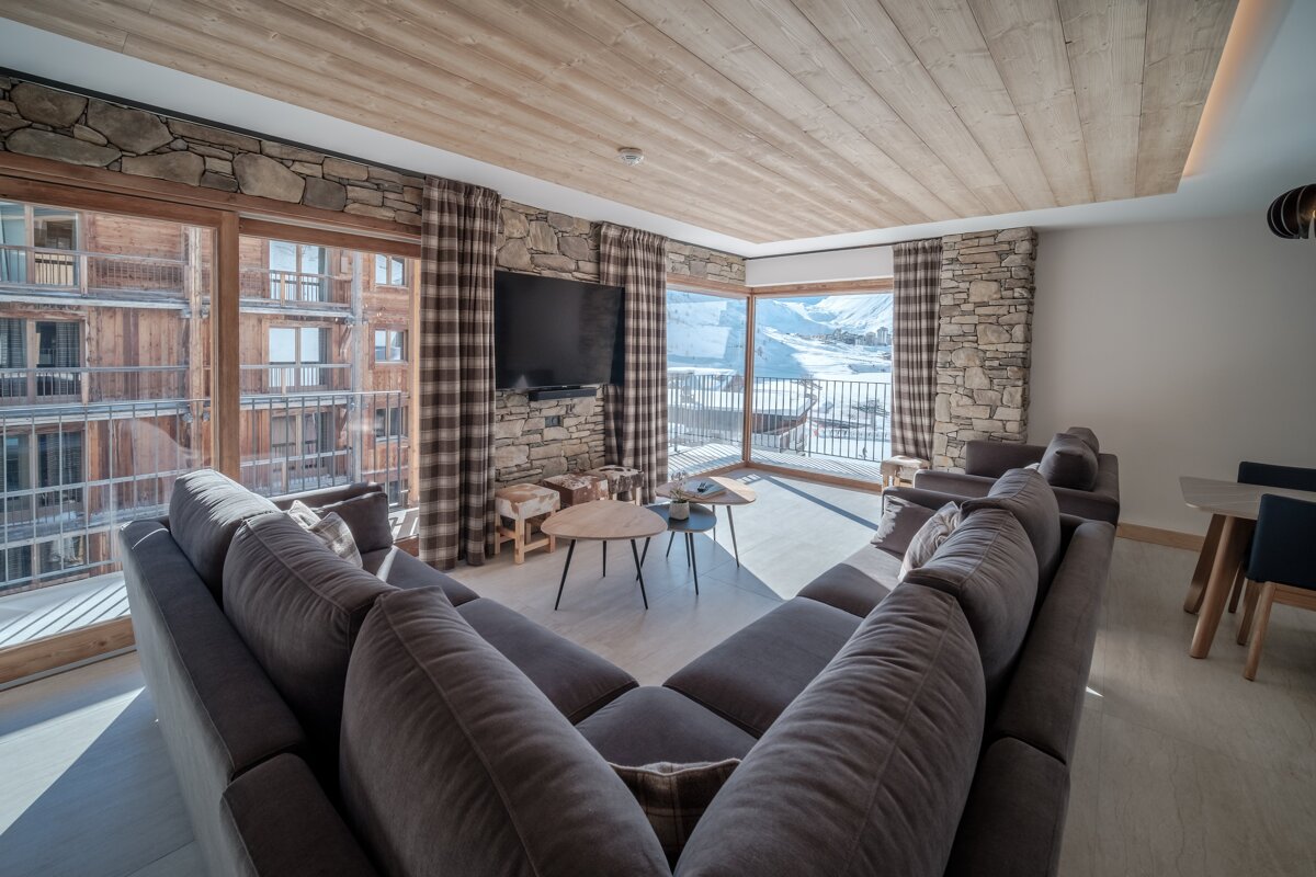 A living room with a couch and a flat screen tv
