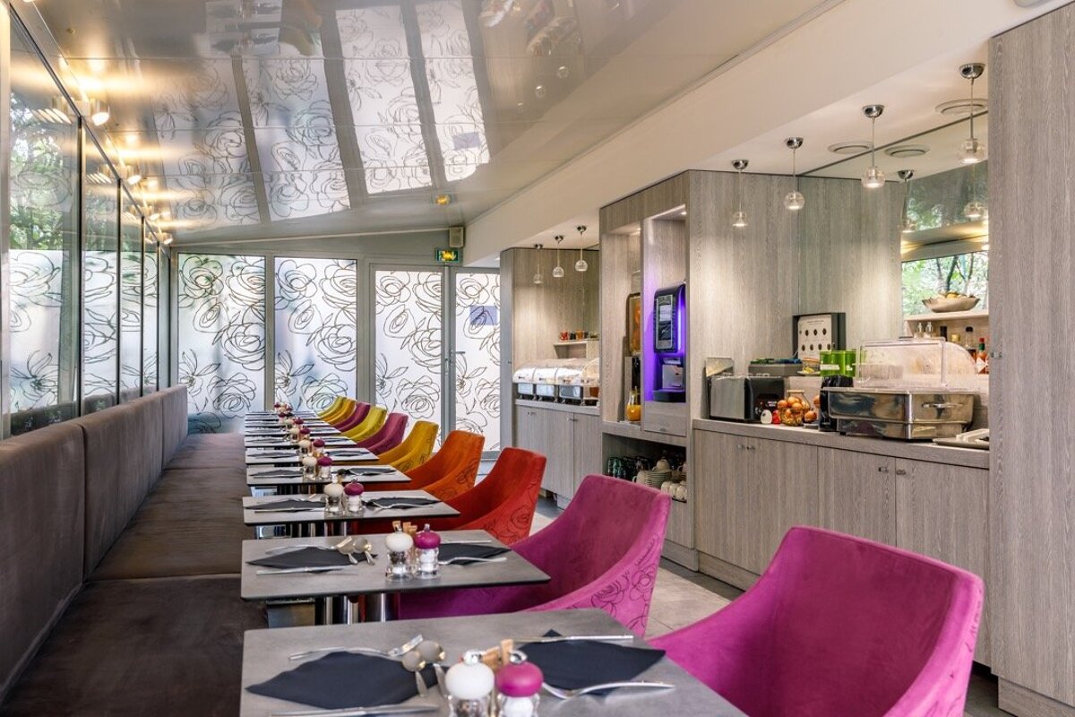 A row of tables and chairs in a restaurant
