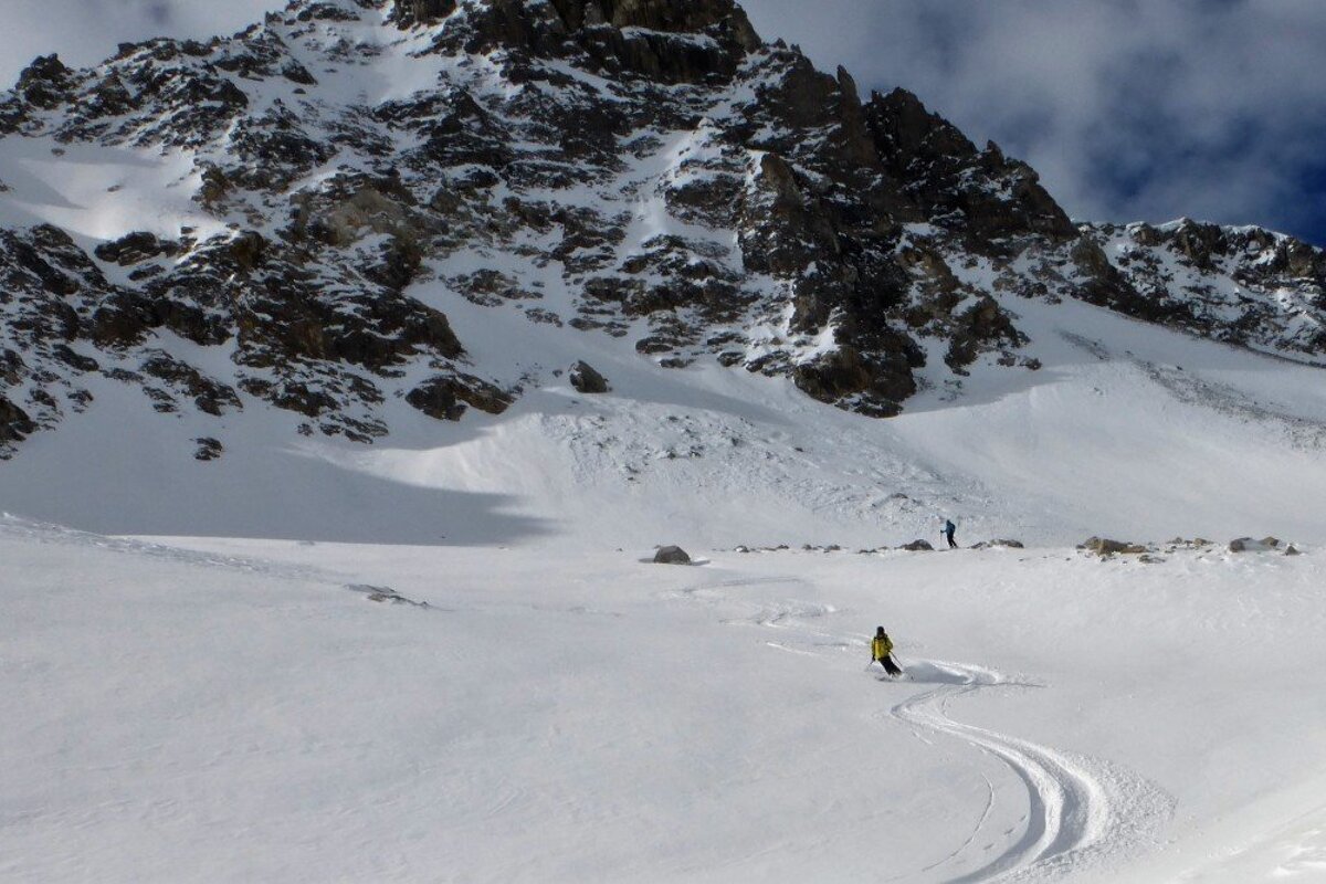 a skier making fresh 