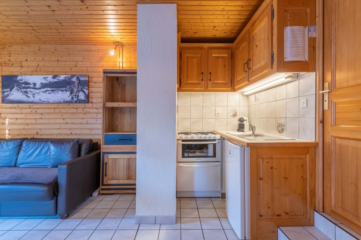 A kitchen with a sign on the wall that says ' a ' on it