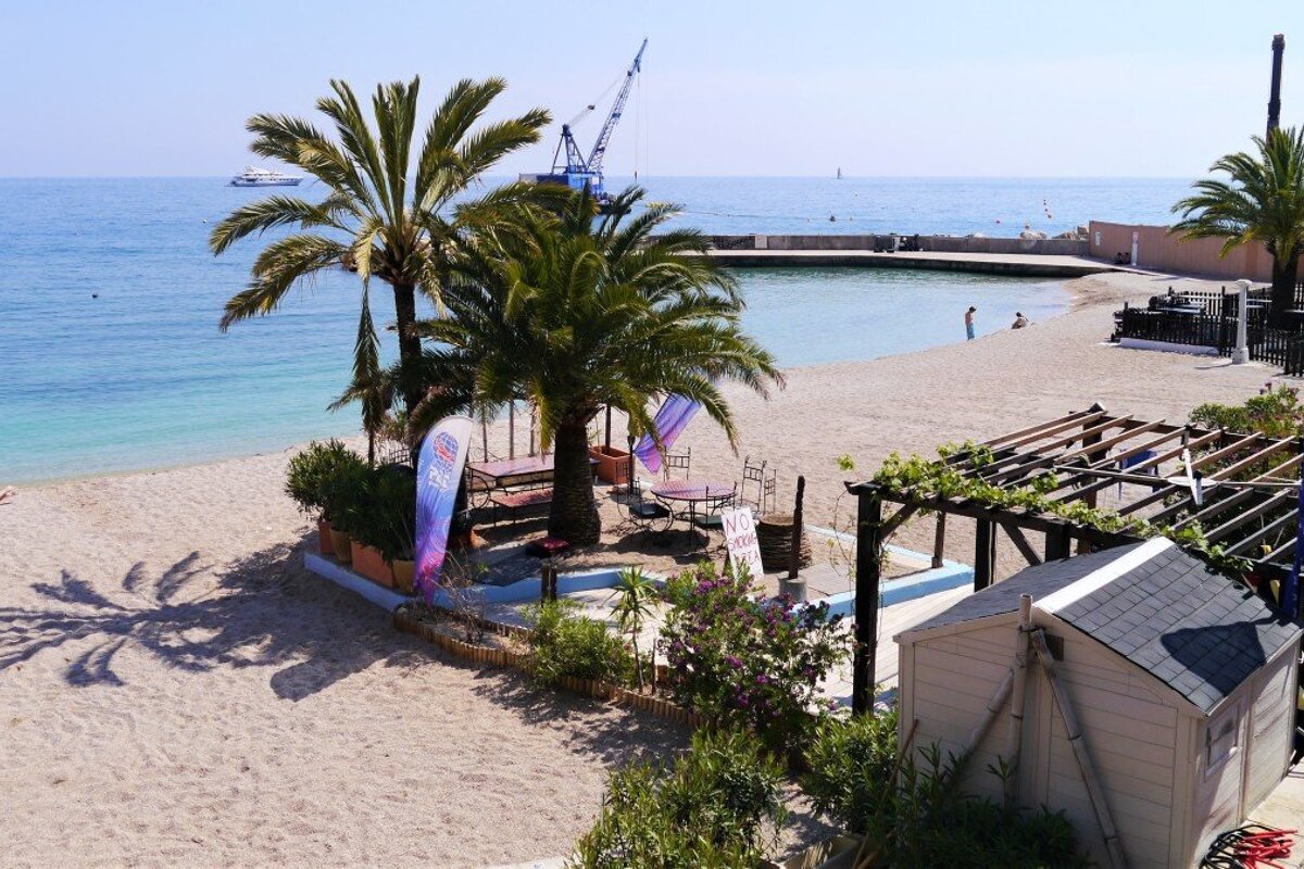 the beach and sea at Plage du Larvotto Beach