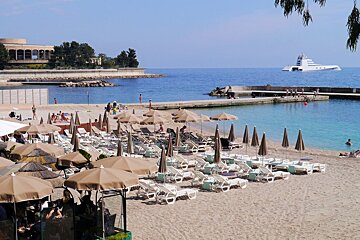 looking down on a beach club at Plage du Larvotto Beach