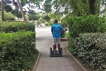 a man on a segway in the parks of Avignon
