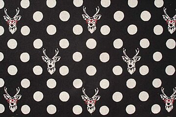 black and white fabric with deer heads on