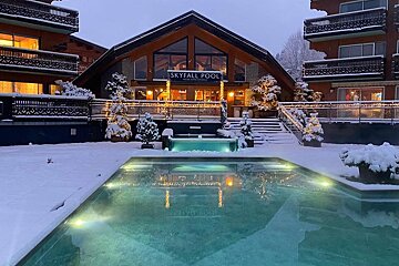 A large building with a sign that says skyfall pool