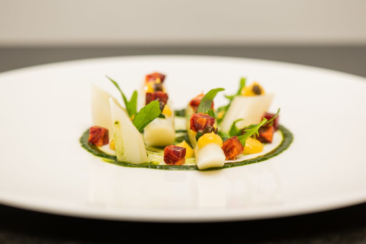 A white plate topped with a variety of vegetables