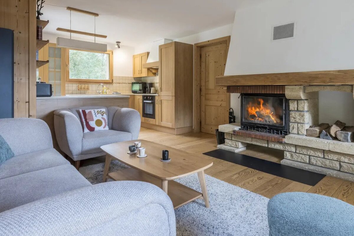 A living room with a fireplace and a couch