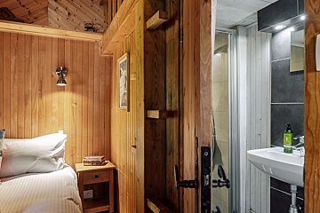 A bathroom with a sink and a picture on the wall