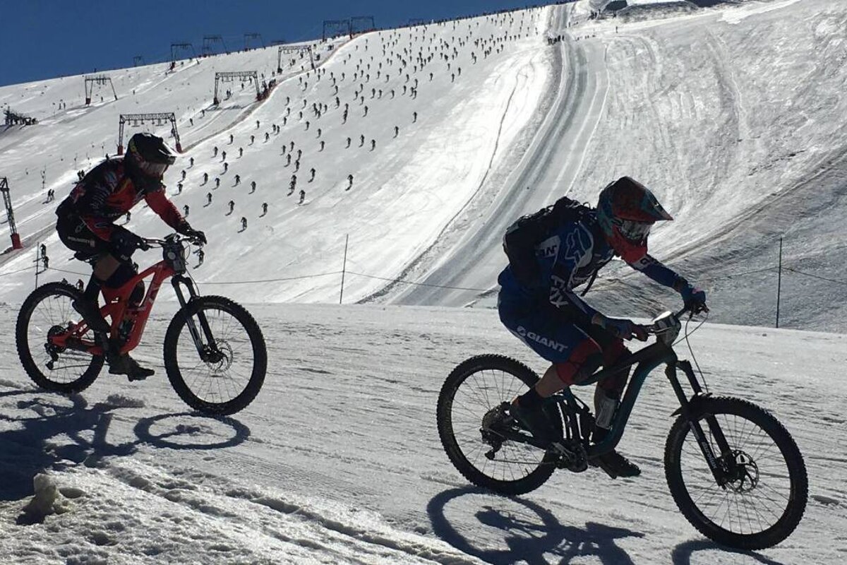 mountain bikers on snow