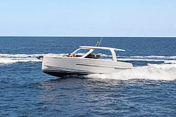 A white boat with the number 6 on the side