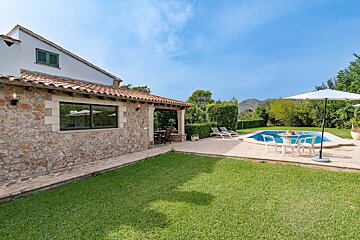 The backyard of a house with a swimming pool
